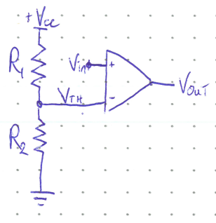 Figure: A circuit with  at the top feeding resistor . The node between  and  is labeled  and connects to the "−" input of a comparator;  connects to the "+" input.  connects the  node to ground. The comparator output is labeled .